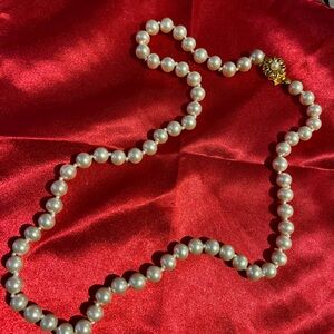 String of faux pearls classic style